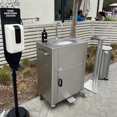 Outdoor Portable Foot Pump Sink on a sidewalk