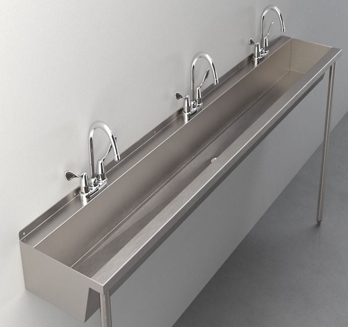 Long stainless steel trough sink with 3 faucets.